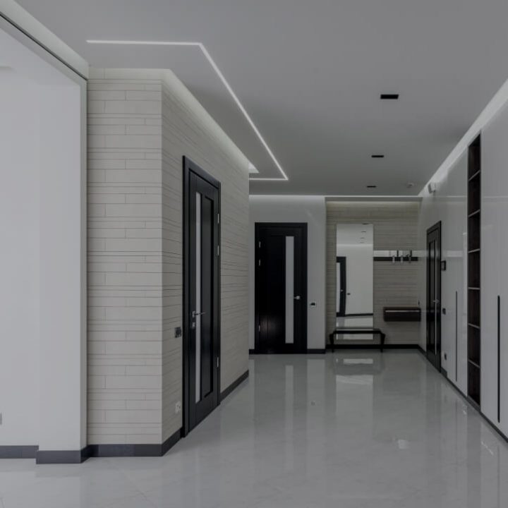 Residential hallway with recessed LED cove lighting along the ceiling