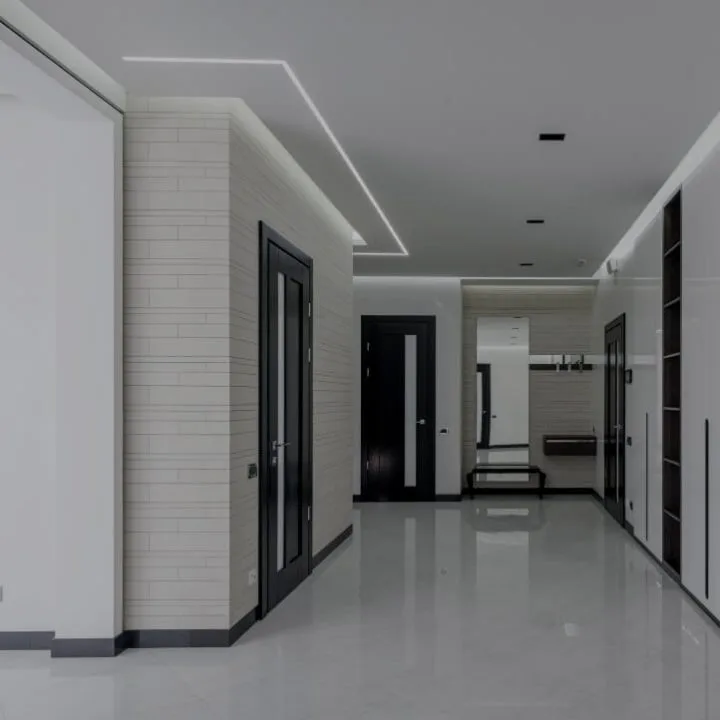 Modern hallway with recessed LED cove lighting installed in the ceiling