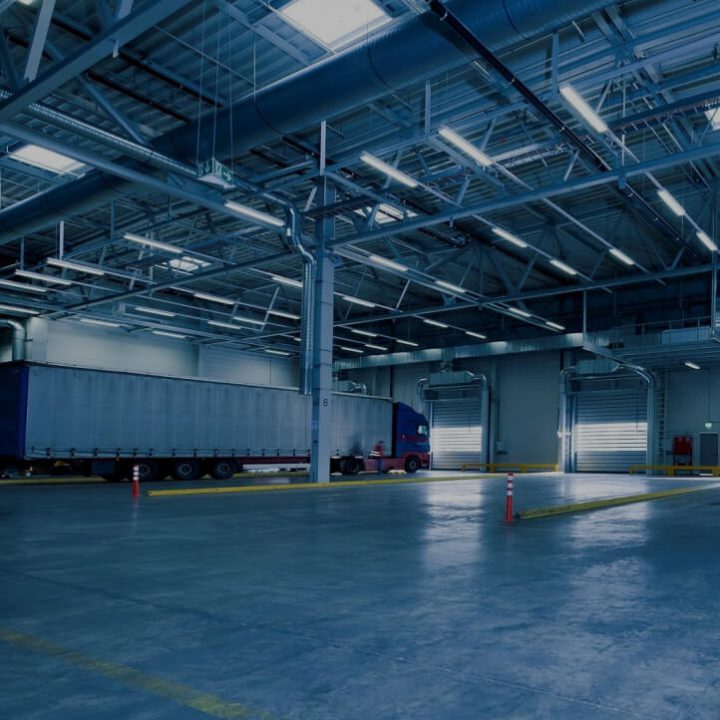 Warehouse ceiling with large spiral ductwork and ventilation runs overhead