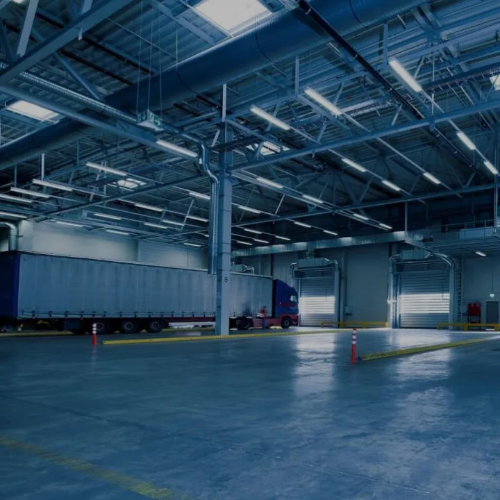 Industrial warehouse ceiling with large spiral ductwork and ventilation runs