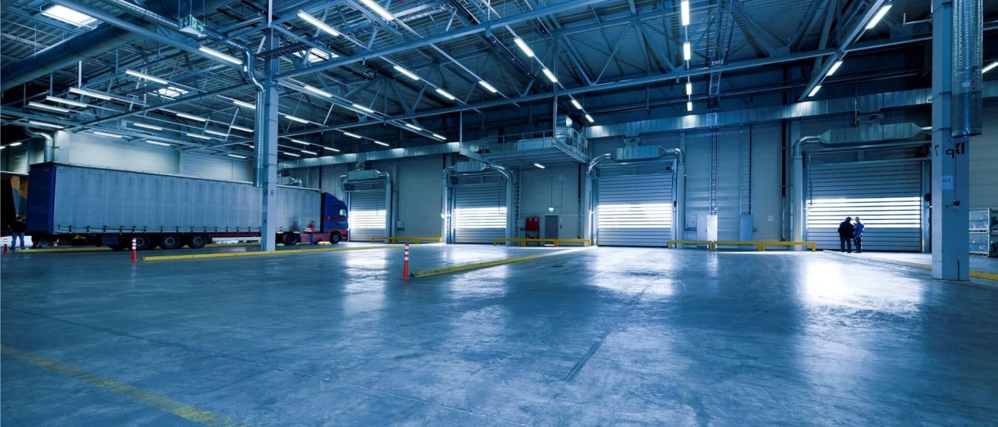 Warehouse interior with overhead lighting and spiral duct distribution